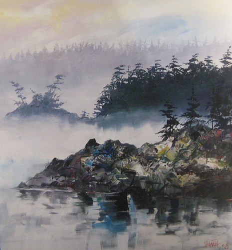 Rocky islands and evergreens in coastal mist