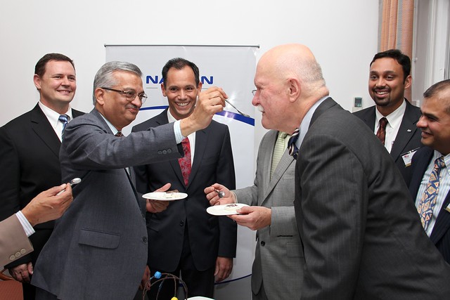 Dr. Anil Kakodkar and Ambassador Burleigh share cake at the third anniversary reception of the U.S.-Indian civilian nuclear partnership