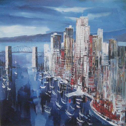 Tall city buildings reflected in deep blue water