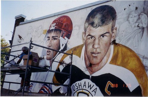 Lift beside two large hockey player portraits