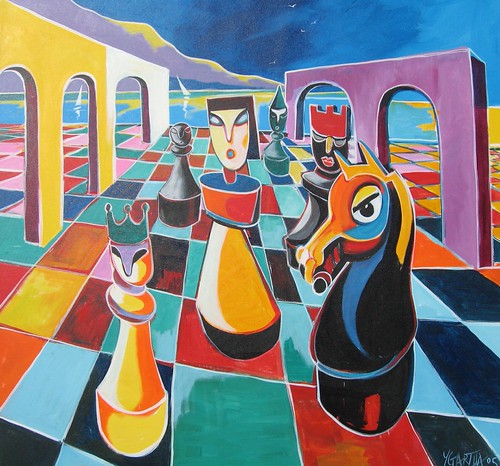 Large colourful chess pieces beneath bright arches
