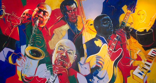 Wide jazz ensemble with brass instruments and keyboard