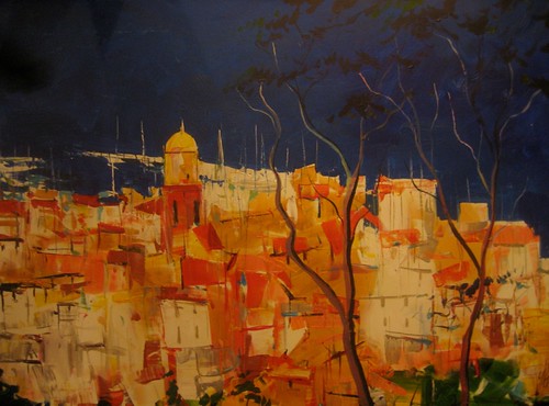 Golden hilltop buildings under a dark sky