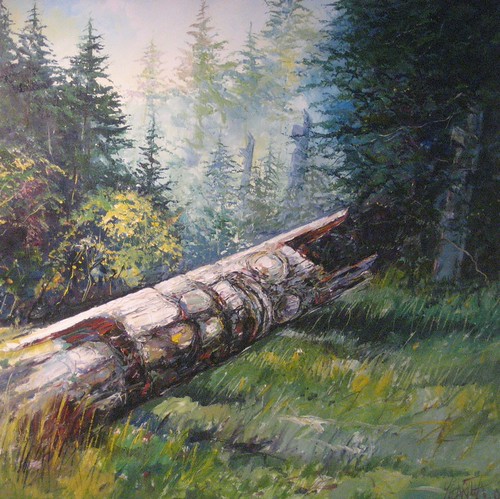 Fallen log in a green forest clearing