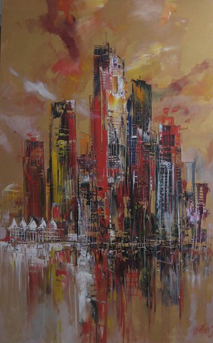 Tall tower with golden and red harbour reflections