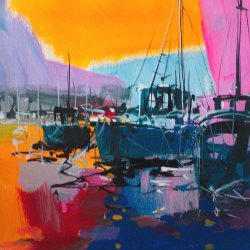 Moored boats beneath yellow and pink sky