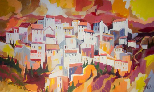 White hillside buildings with warm red roofs