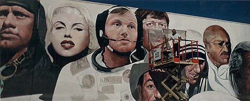 Portrait faces in a blue-background wall mural