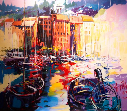 Boats and waterfront buildings in bright reflected colours