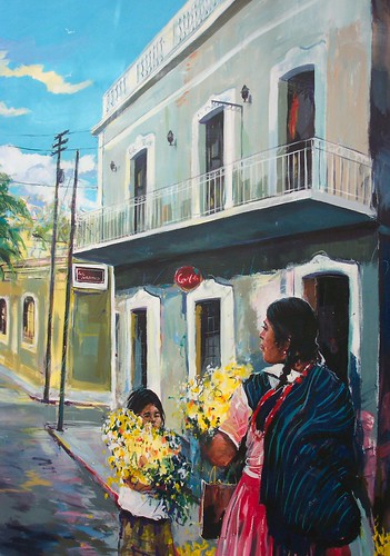 Woman holding flowers on a street