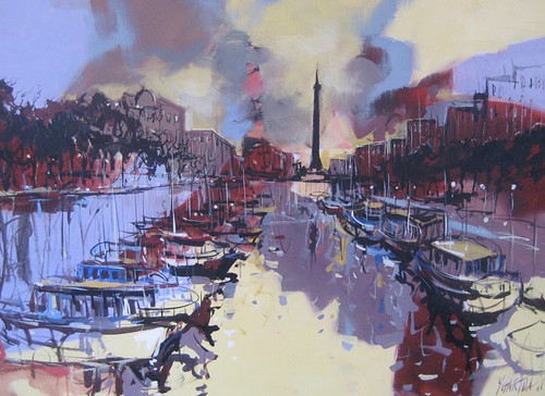 Boats along a river beneath a cloudy skyline