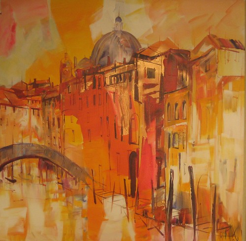Domed buildings reflected in golden water