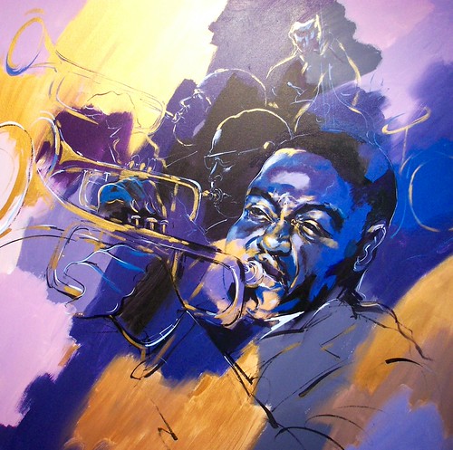Saxophonist surrounded by blue and yellow brushwork