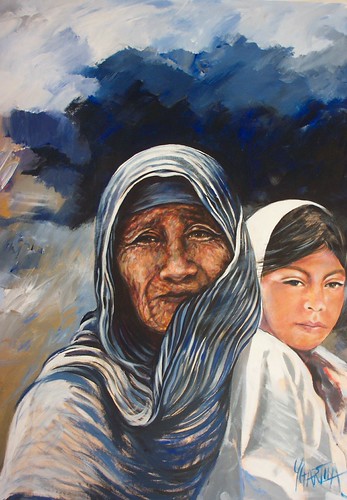 Two women wearing blue and white wraps