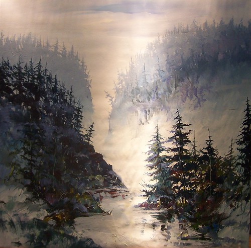 Light reflecting on a narrow forest inlet