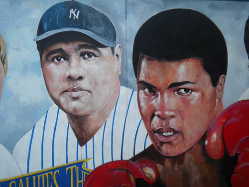 Mural portraits of a baseball player and boxer