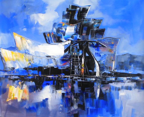 Angular riverside building with blue and white reflections