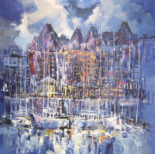Illuminated harbour buildings with layered reflections