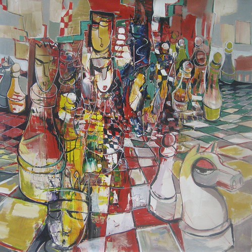 Tall chess pieces on a multicoloured board