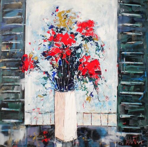 Red and white flowers framed by window shutters