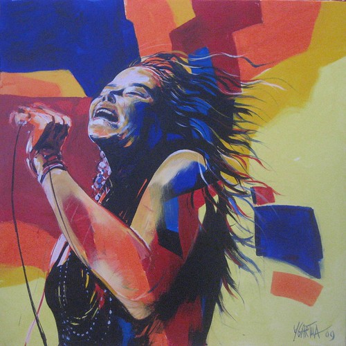 Singer leaning back with a microphone