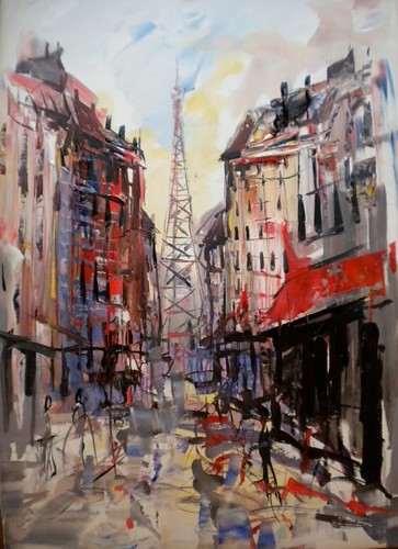 Narrow city street with buildings and a distant tower