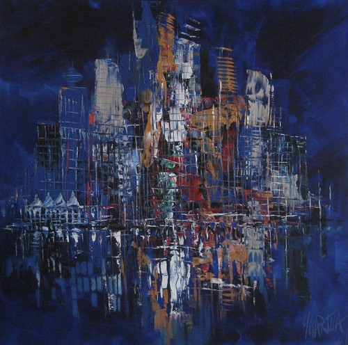 Night skyline with blue and golden reflections