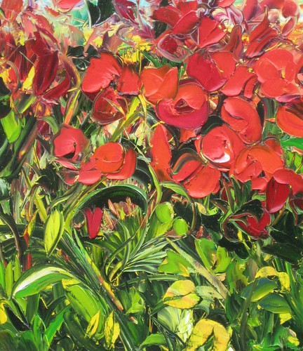Red flowers above dense green foliage