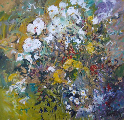 White flowers among green and purple foliage