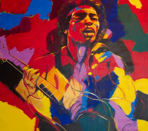 Guitarist and singer in bright red and blue