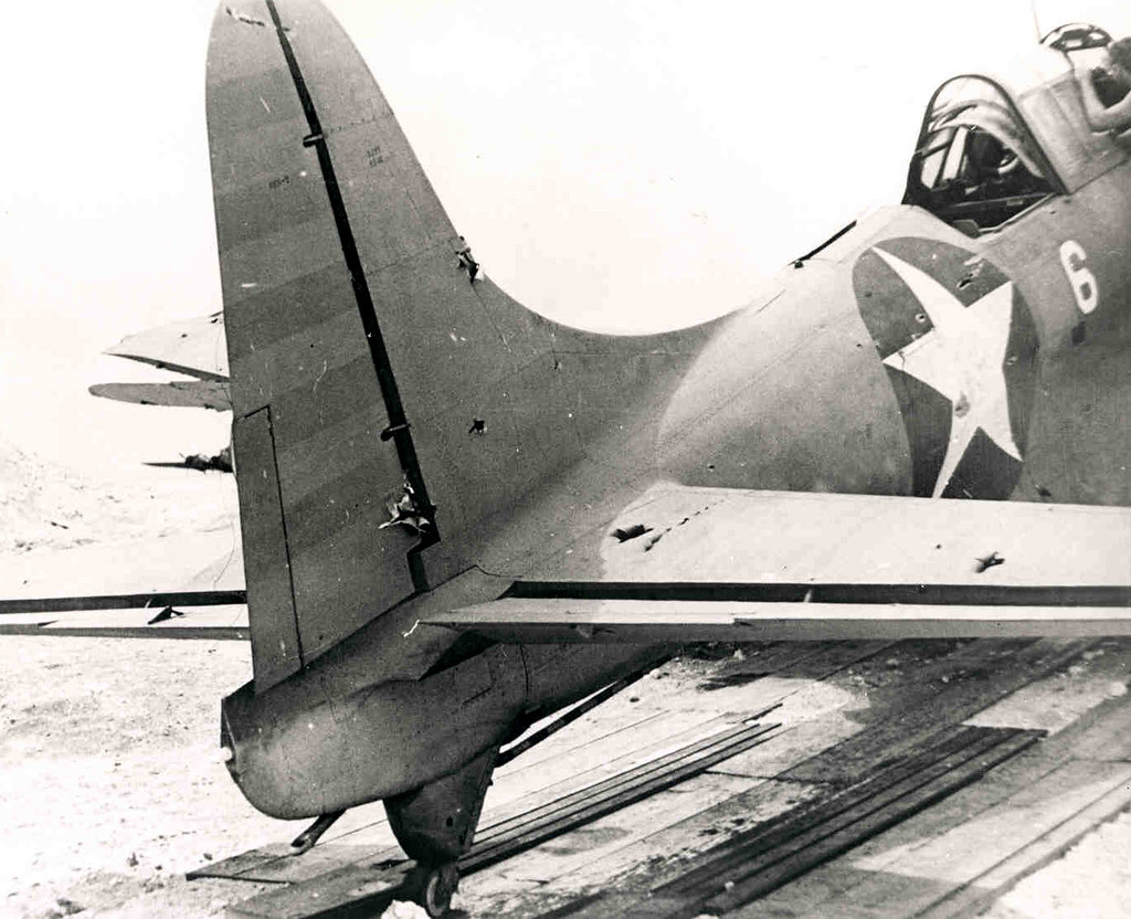 View of the tail of Douglas SBD-2 Dauntless (BuNo 2106) showing battle damage inflicted during the Battle of Midway. This photograph was taken on the Midway Atoll.