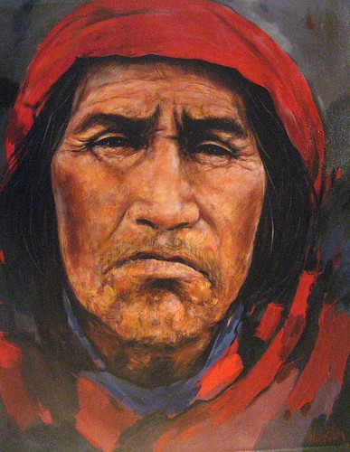 Portrait of a man wearing a red head covering