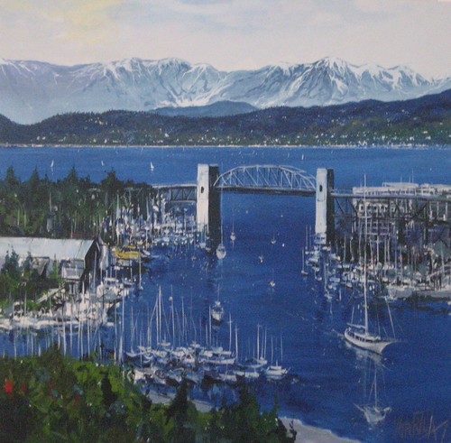 Bridge over blue water beneath distant mountains