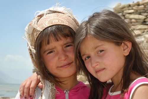 Young Wakhi girls in Vrang (Tajikistan), in fashion pink color, and with nail varnish, altought the nicely fitted scarf on the left head looks more local and is particularly photogenic. © Bernard Grua