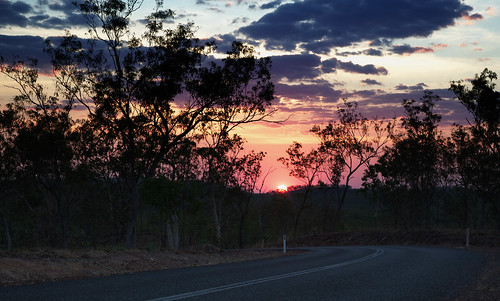 sunset nature weather clouds landscape woods australia location roads northernterritory timeofday pavedroad imagetype