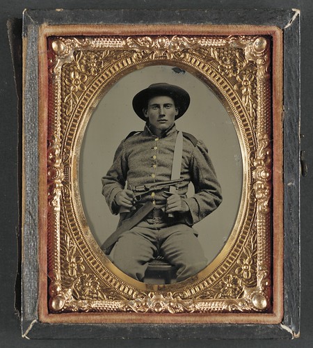 [Unidentified soldier in Confederate frock coat and slouch hat with Bowie knife and Colt Army Model 1860 revolver] (LOC) | by The Library of Congress