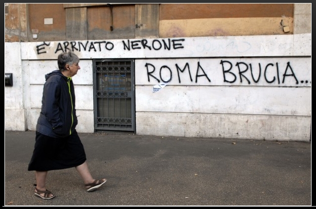 Roma Indignati - During the Protect in Rome Vandals Cover the Colosseum, and other buildings along the Via dei Fori Imperiali & Via Cavour with Graffiti. La Repubblica (17/10/2011).