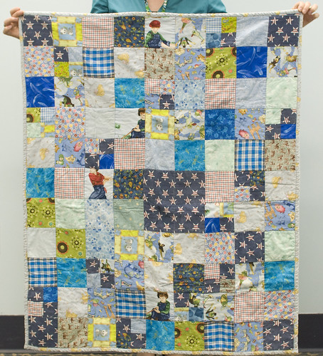 I had a fifth big square left of the star fabric, so I decided to do a true 'baby' quilt in addition to the twin-sized main quilt.

This set of two quilts was for Annie, a co-worker of mine at the library. The main sentimental part of the quilt is the star fabric, which came from a shirt of her mother's. Her mother, Helen, was a co-worker of mine as well until she died of cancer not too long before Annie's son was born. 

Full quilt info is at domesticat.net/quilts/snips