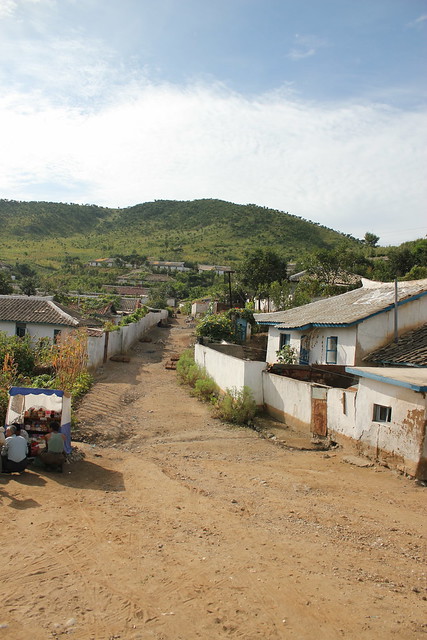 Village road with Seller in North Korea