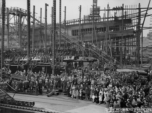 Spectators and workers at the launch of the cargo ship 'Baskerville'