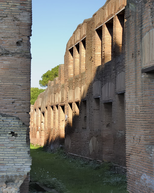 Partly reconstructed multi-storey 'insula' on typical narrow street - Ostia Antica, Lazio, Italy.