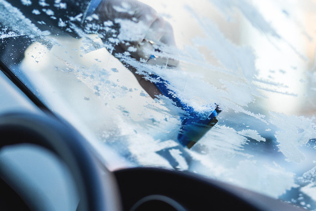 Removing frost from car windshield