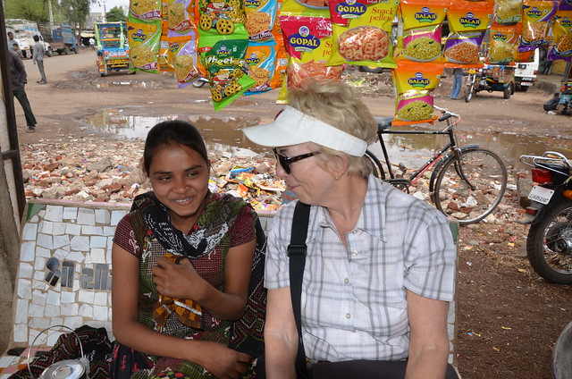 Gina talking to a vendor in Gujarat