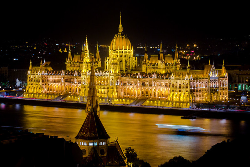 Night Time view of the Hungarian Parliament Building over the Danube River, Budapest, Hungary, Europe