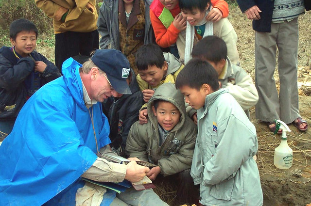 Working with rural children in southern China, describing soils.