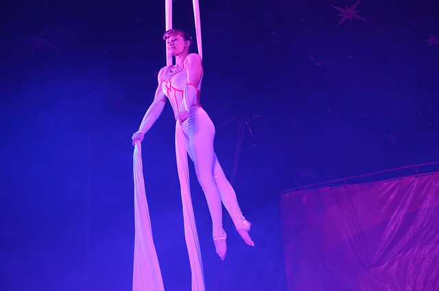 Acrobat Miss Monika doing aerial ribbon work at John Lawson's circus