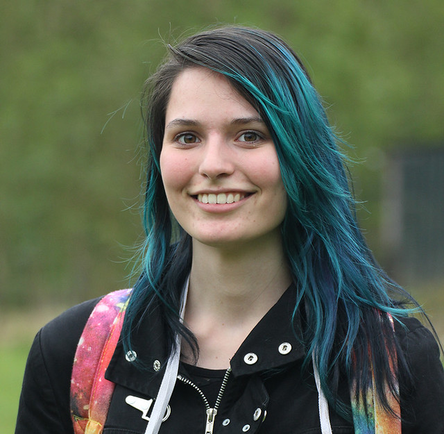 Blue hair, big smile