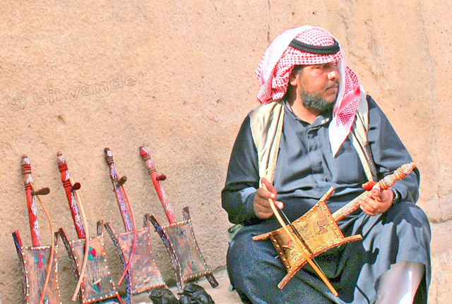 Syria.  Palmyra, Beduin man selling rebabs, single-string music instruments