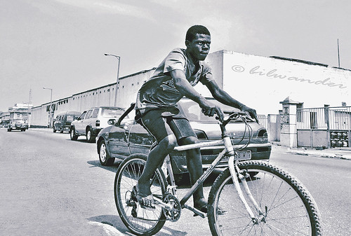 ghana accra jamestown cyclist boy sepia usshertown ghαna solo travel bilwander gηανα bicycle africa westafrica african west