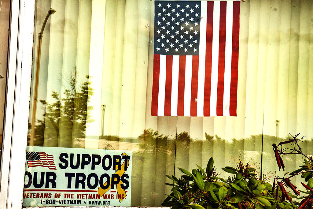 Flag and SUPPORT OUR TROOPS sign in window at 44 N River St--Wilkes Barre
